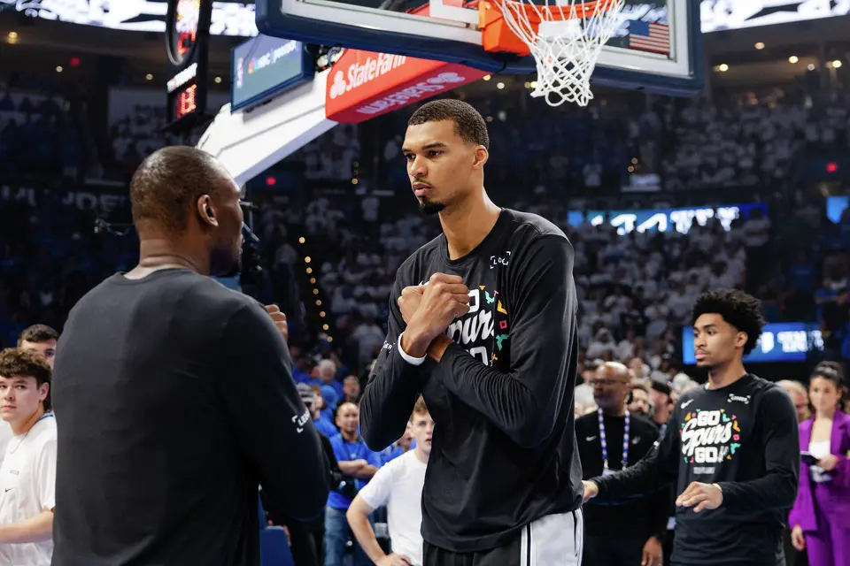 San Antonio Spurs forward Victor Wembanyama (1) gestures to teammate San Antonio Spurs center Bismack Biyombo (18) before Game 2 of the Western Conference Finals at Paycom Center in Oklahoma City, Wednesday, May 20, 2026.