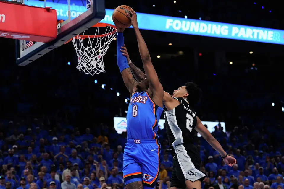 Oklahoma City Thunder guard Jalen Williams (8) shoots against San Antonio Spurs guard Dylan Harper (2) during overtime of Game 1 in a third-round NBA basketball playoffs series Monday, May 18, 2026, in Oklahoma City.