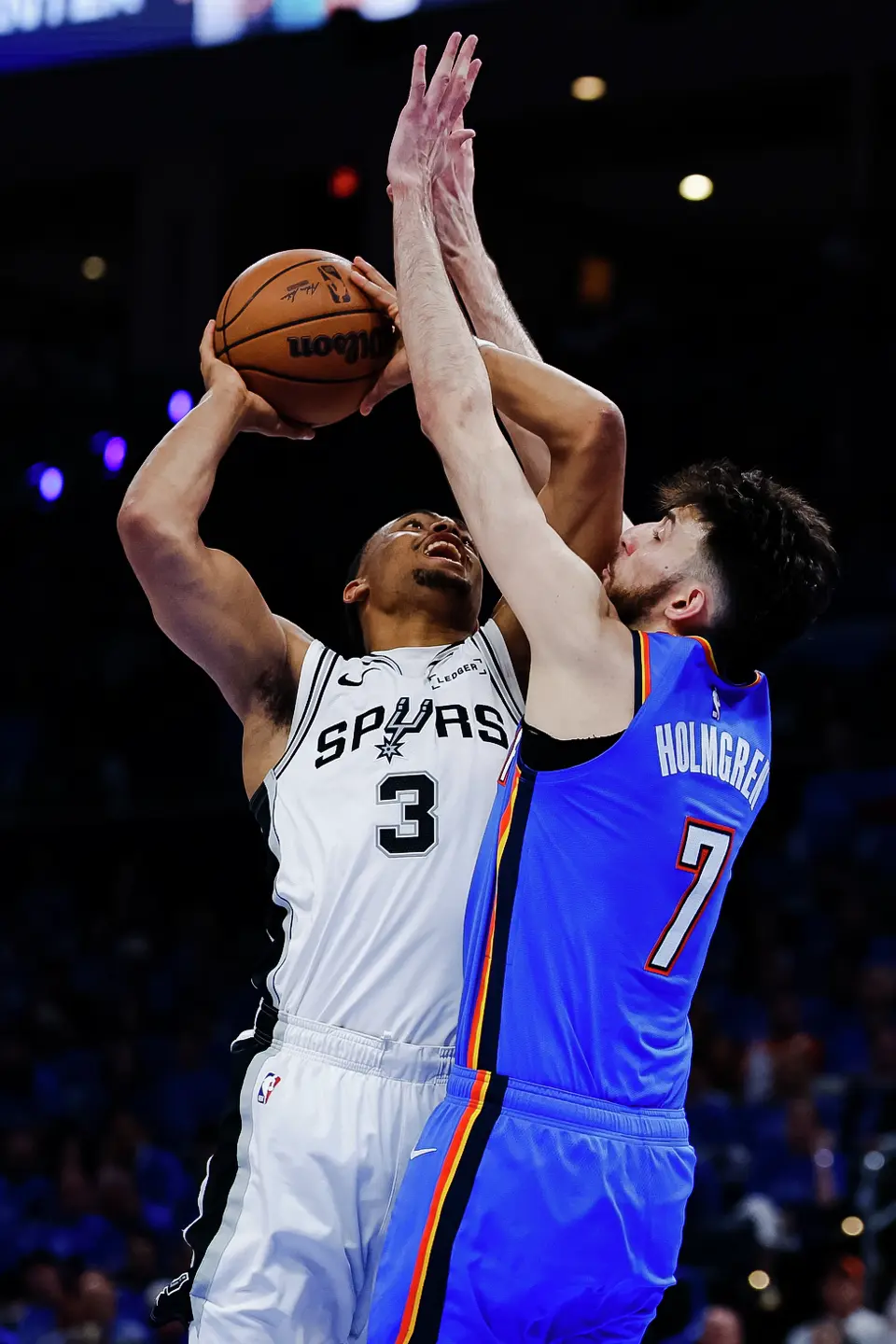 San Antonio Spurs forward Keldon Johnson (3) goes up for a shot while guarded by Oklahoma City Thunder center Chet Holmgren (7) during the third quarter of Game 2 of the Western Conference Finals at Paycom Center in Oklahoma City, Wednesday, May 20, 2026.