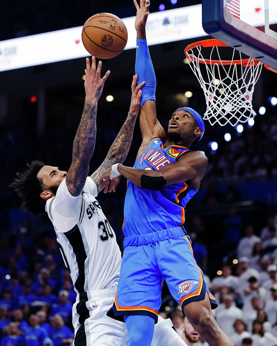 San Antonio Spurs forward Julian Champagnie (30) goes up for a shot around Oklahoma City Thunder guard Shai Gilgeous-Alexander (2) during the third quarter of Game 2 of the Western Conference Finals at Paycom Center in Oklahoma City, Wednesday, May 20, 2026.