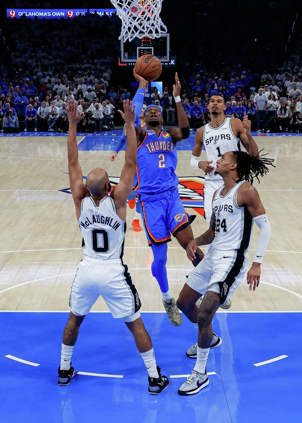 San Antonio Spurs guard Dylan Harper (2) shoots over San Antonio Spurs guard Jordan McLaughlin (0) and guard Devin Vassell (24) during Game 2 of the Western Conference Finals at Paycom Center in Oklahoma City, Wednesday, May 20, 2026. The Spurs fell 122-113 to the Thunder.