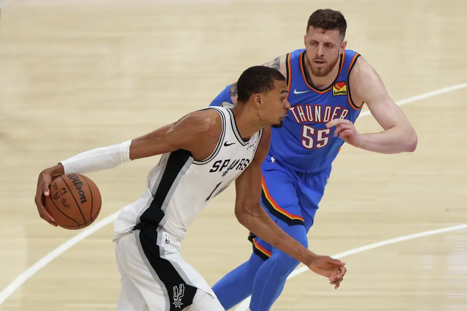 San Antonio Spurs forward Victor Wembanyama (1) controls the ball against Oklahoma City Thunder center Isaiah Hartenstein (55) during the second half of Game 2 in the Western Conference finals NBA basketball playoffs series Wednesday, May 20, 2026, in Oklahoma City.