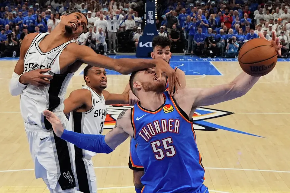 San Antonio Spurs forward Victor Wembanyama (1) defends against Oklahoma City Thunder center Isaiah Hartenstein (55) during the second half of Game 2 in the Western Conference finals NBA basketball playoffs series Wednesday, May 20, 2026, in Oklahoma City.
