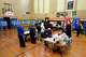 FILE - Voters wait to receive their ballots at a polling place at McDonald Elementary School, Nov. 5, 2024, in Dearborn, Mich.