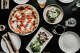 Los miembros de BTS comieron pizza y otros platos de Vesta en Redwood City tres veces durante su visita al Área de la Bahía.