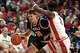 Northern Arizona guard Isaiah Shaw (24) drives on Arizona guard Dwayne Aristode during the first half of an NCAA college basketball game, Tuesday, Nov. 11, 2025, in Tucson, Ariz. (AP Photo/Rick Scuteri)