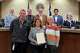 Midland community champion Tracy Karst-Culler (far right) stands with board members from Midland Crime Stoppers during a Midland County commissioner's court meeting, 