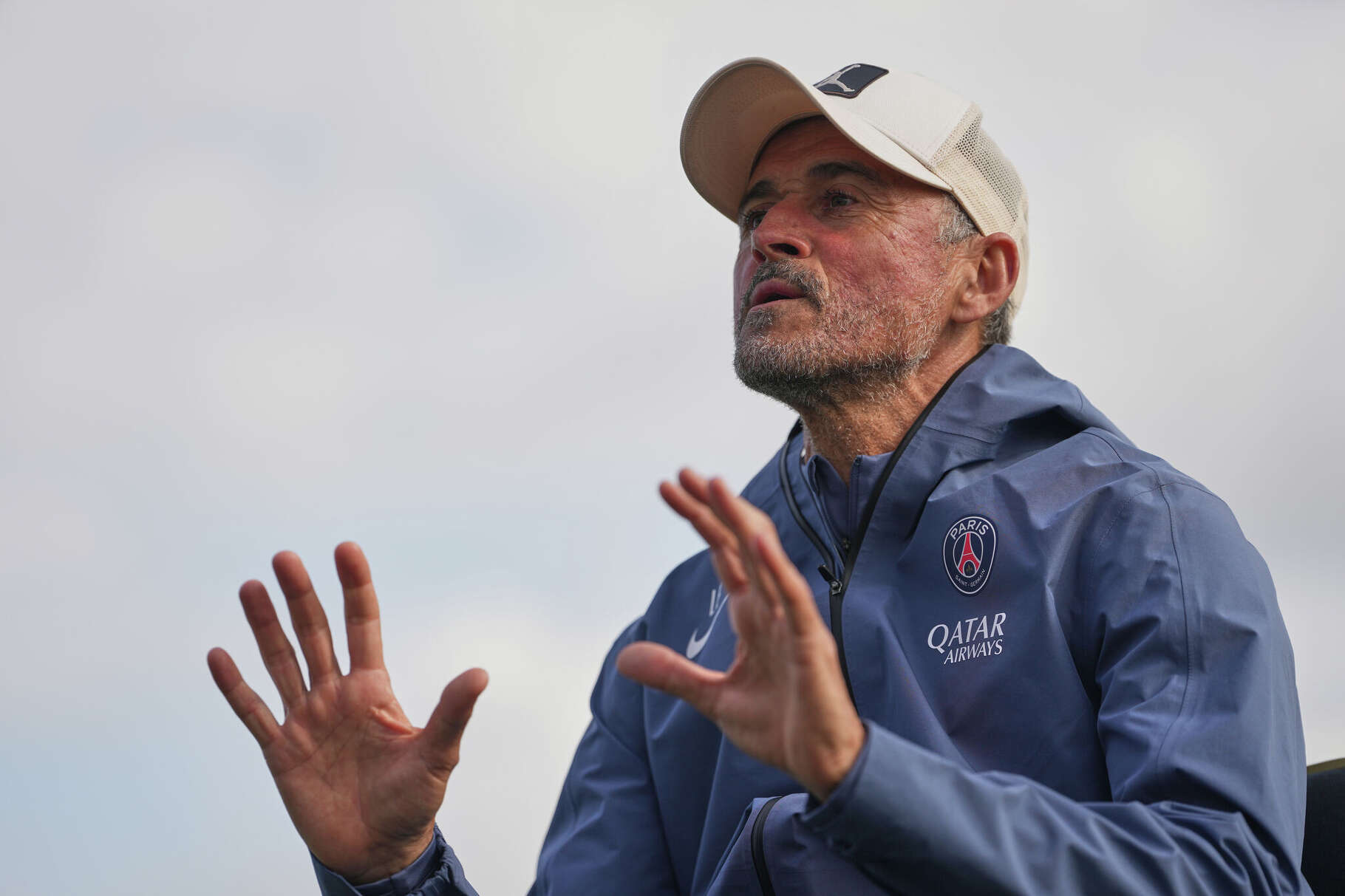 PSG's head coach Luis Enrique talks to his squad during a training session at the Paris Saint-Germain training center Wednesday May 20, 2026, in Poissy, west of Paris, ahead of the Champions League final against Arsenal in Budapest on May 30. (AP Photo/Thibault Camus)
