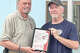 Illinois State Crime Stoppers Association President Loren Hamilton (left) presents Brad Fellhauer of Jacksonville with its Outstanding Board Member of the Year award. Fellhauer is past president of Crime Stoppers of Morgan, Scott & Cass Counties.