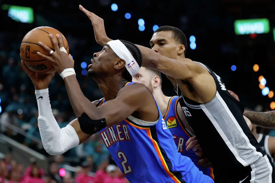 San Antonio Spurs forward Victor Wembanyama (1) comes from behind to try and block the shot of Oklahoma City Thunder guard Shai Gilgeous-Alexander (2) during the first half of Game 3 of the Western Conference Finals at Frost Bank Center in San Antonio, Friday, May 22, 2026.