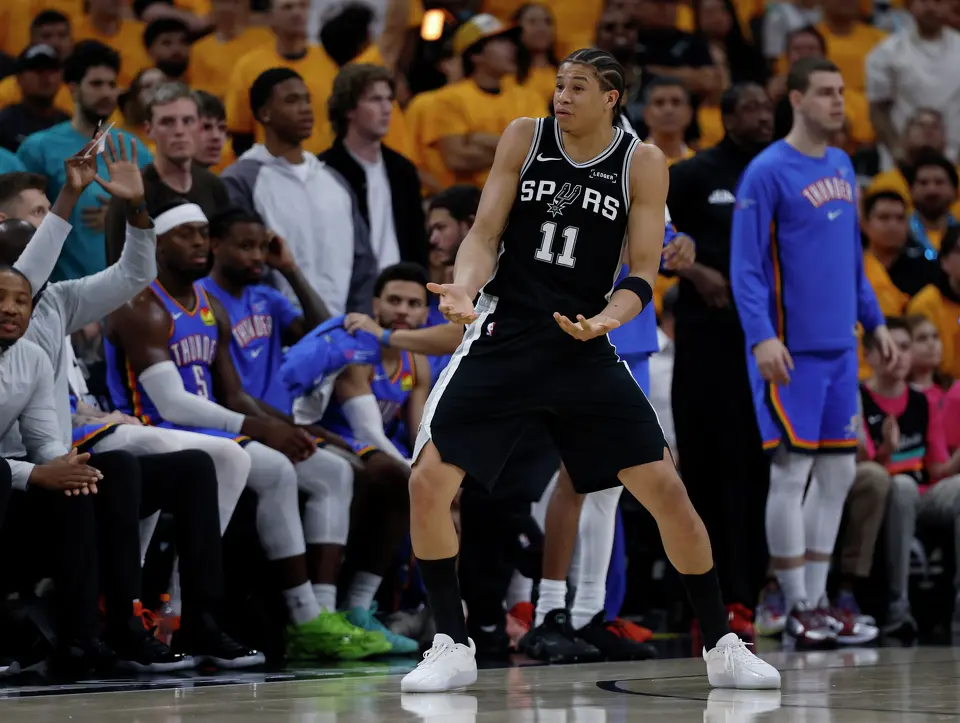 San Antonio Spurs forward Carter Bryant (11) looks to the bench for instructions during the third quarter of Game 3 of the Western Conference Finals at Frost Bank Center in San Antonio, Friday, May 22, 2026.