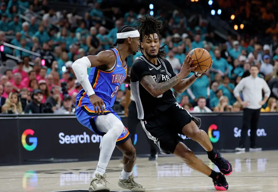 San Antonio Spurs guard Stephon Castle (5) tries to get past Oklahoma City Thunder guard Shai Gilgeous-Alexander (2) during the third quarter of Game 3 of the Western Conference Finals at Frost Bank Center in San Antonio, Friday, May 22, 2026.