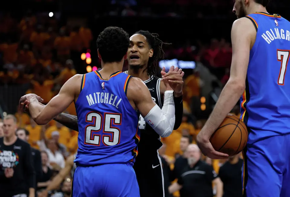 San Antonio Spurs guard Devin Vassell (24) confronts Oklahoma City Thunder guard Ajay Mitchell (25) after a flagrant foul on San Antonio Spurs guard Stephon Castle (5), not pictured, during the third quarter of Game 3 of the Western Conference Finals at Frost Bank Center in San Antonio, Friday, May 22, 2026.