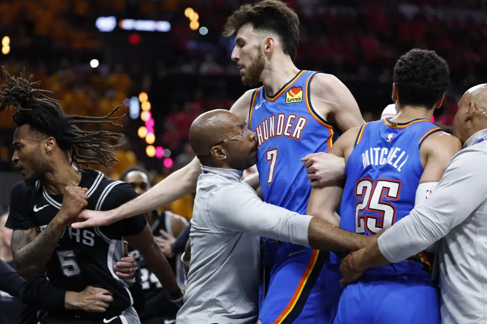 NBA staff separates San Antonio Spurs guard Stephon Castle (5), Oklahoma City Thunder center Chet Holmgren (7) after Oklahoma City Thunder guard Ajay Mitchell (25) was given a flagrant foul call during the third quarter of Game 3 of the Western Conference Finals at Frost Bank Center in San Antonio, Friday, May 22, 2026.