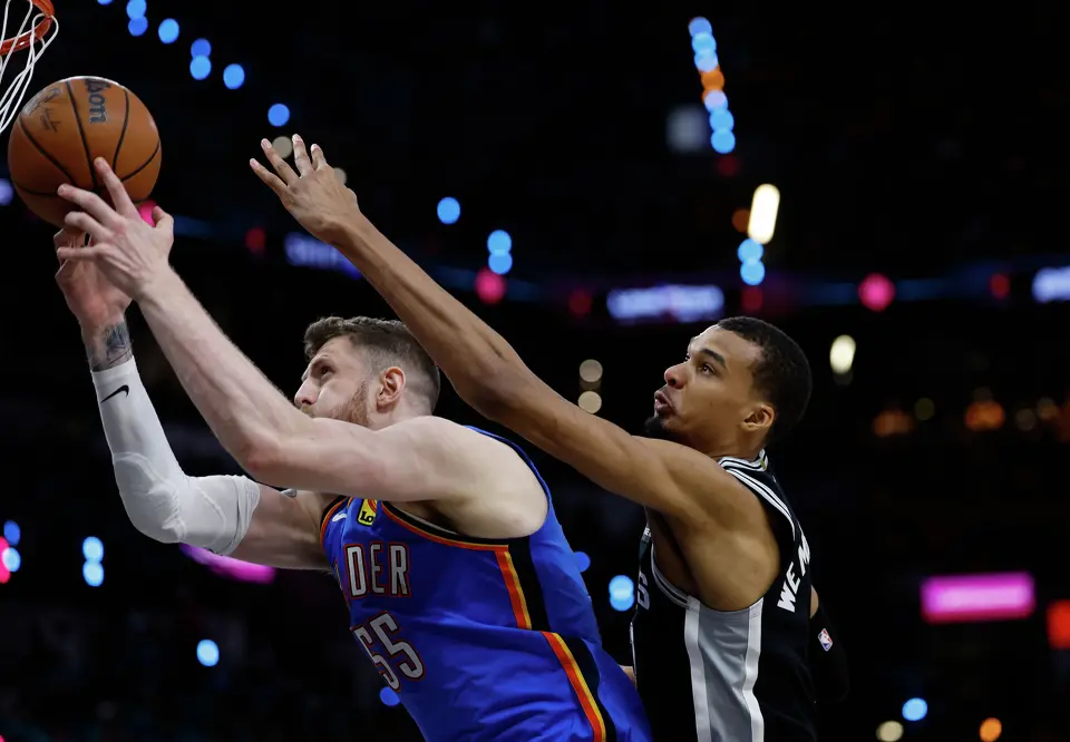 San Antonio Spurs forward Victor Wembanyama (1) tries to stop a shot by Oklahoma City Thunder center Isaiah Hartenstein (55) during the second half of Game 3 of the Western Conference Finals at Frost Bank Center in San Antonio, Friday, May 22, 2026. The Spurs fell 123-108 to the Thunder, who now lead the series 2-1.