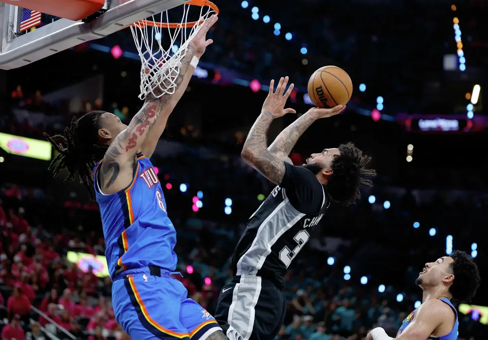 San Antonio Spurs forward Julian Champagnie (30) goes for the layup over Oklahoma City Thunder forward Jaylin Williams (6) during the second half of Game 3 of the Western Conference Finals at Frost Bank Center in San Antonio, Friday, May 22, 2026. The Spurs fell 123-108 to the Thunder, who now lead the series 2-1.