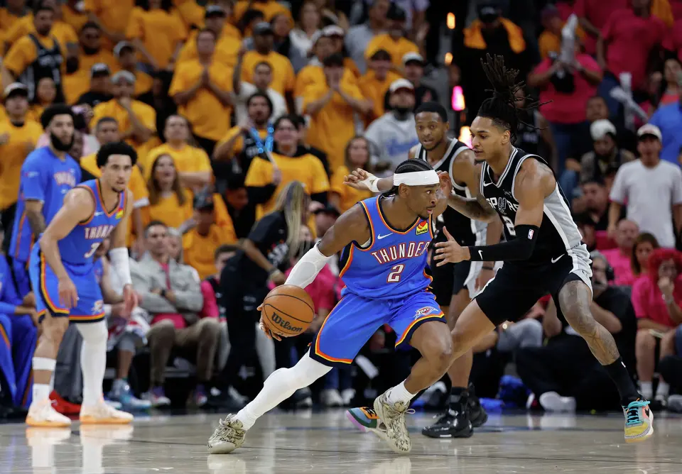 San Antonio Spurs guard Devin Vassell (24) guards Oklahoma City Thunder guard Shai Gilgeous-Alexander (2) during the second half of Game 3 of the Western Conference Finals at Frost Bank Center in San Antonio, Friday, May 22, 2026. The Spurs fell 123-108 to the Thunder, who now lead the series 2-1.