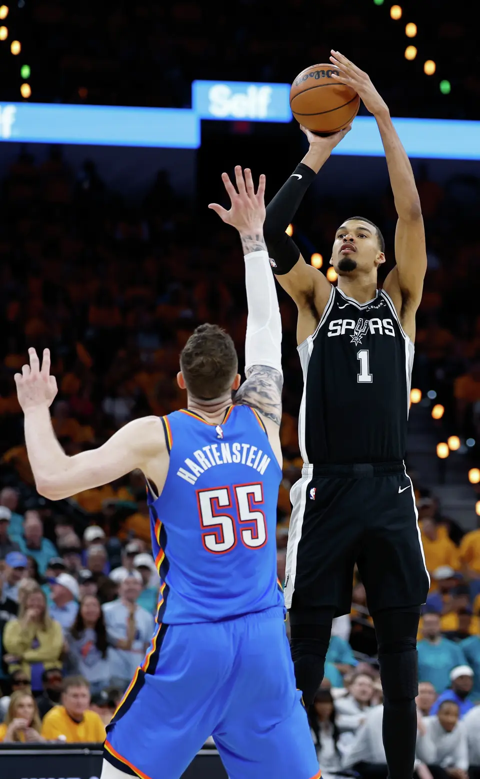 San Antonio Spurs forward Victor Wembanyama (1) lets the ball fly over the top of Oklahoma City Thunder center Isaiah Hartenstein (55) during the second half of Game 3 of the Western Conference Finals at Frost Bank Center in San Antonio, Friday, May 22, 2026. The Spurs fell 123-108 to the Thunder, who now lead the series 2-1.