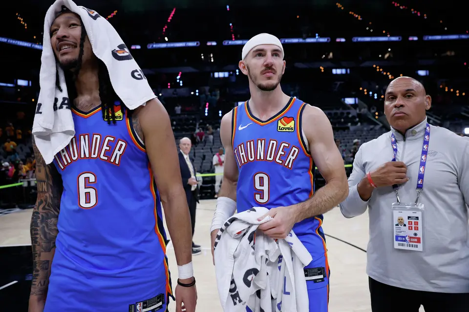 Oklahoma City Thunder forward Jaylin Williams (6) and Oklahoma City Thunder guard Alex Caruso (9) walk off the court after winning Game 3 of the Western Conference Finals at Frost Bank Center in San Antonio, Friday, May 22, 2026. The Spurs fell 123-108 to the Thunder, who now lead the series 2-1.