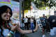 A fan carries a tower of wine glasses to the next stage during the first day of BottleRock Music Festival held at the Napa Valley Expo in Napa, Calif. Friday, May 22, 2026.