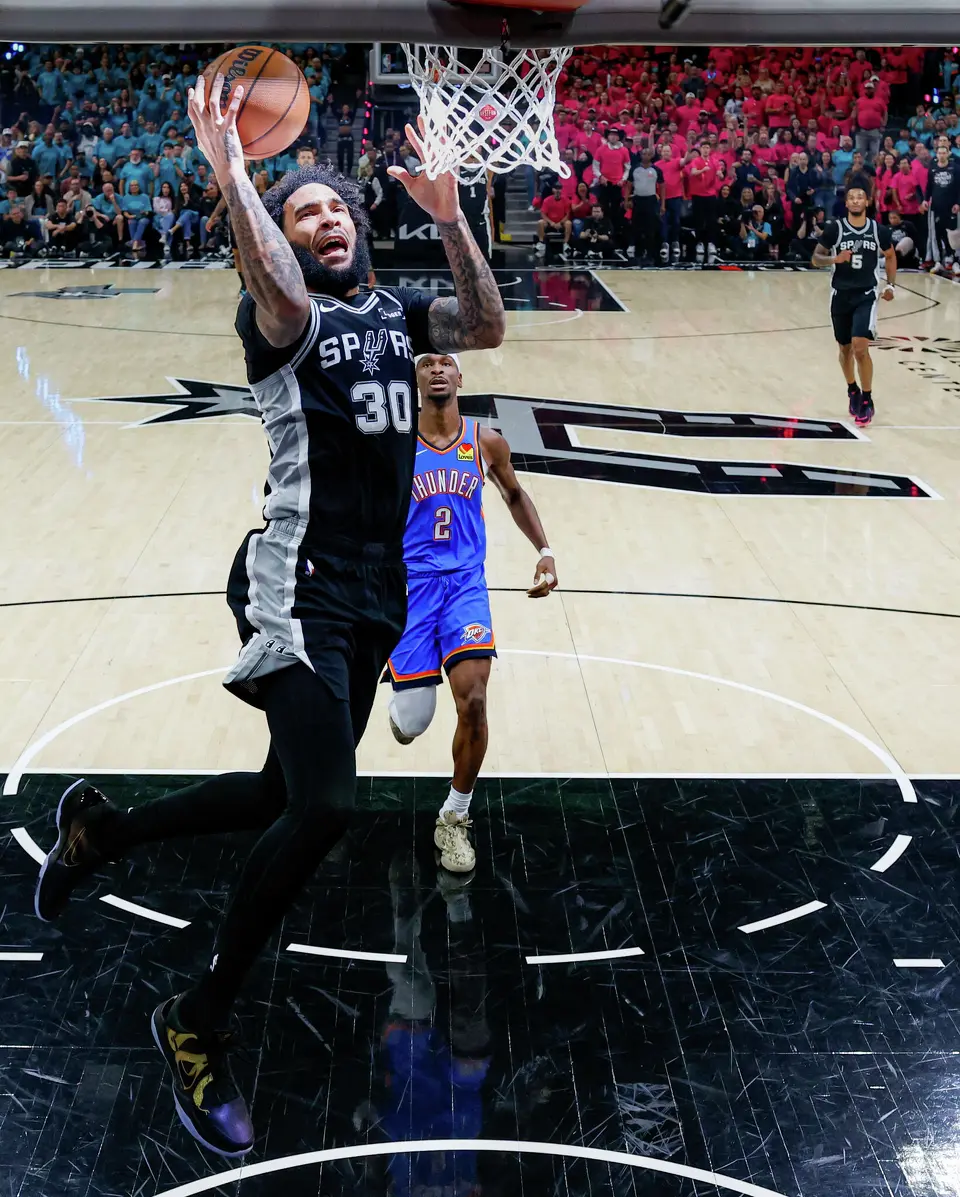 San Antonio Spurs forward Julian Champagnie (30) lays the ball in during Game 3 of the Western Conference Finals Oklahoma City Thunder at Frost Bank Center in San Antonio, Friday, May 22, 2026. The Spurs fell 123-108 to the Thunder, who now lead the series 2-1.