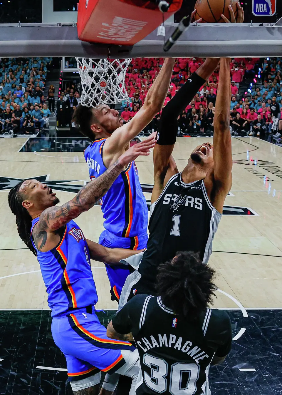 Oklahoma City Thunder center Chet Holmgren (7) blocks a shot from San Antonio Spurs center Victor Wembanyama (1) during Game 3 of the Western Conference Finals at Frost Bank Center in San Antonio, Friday, May 22, 2026. The Spurs fell 123-108 to the Thunder, who now lead the series 2-1.