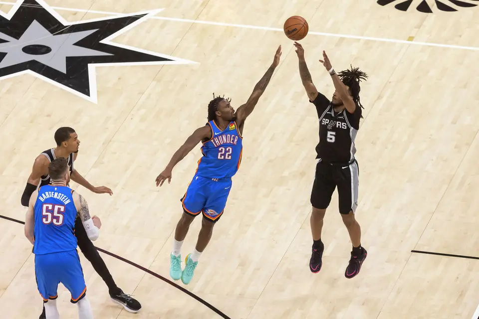 San Antonio Spurs guard Stephon Castle (5) jumps to shoot the ball as Oklahoma City Thunder guard Cason Wallace (22) defends during Game 3 of the Western Conference Finals at Frost Bank Center in San Antonio on Friday, May 22, 2026.