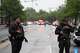 Police and members of the Secret Service block streets around the White House.