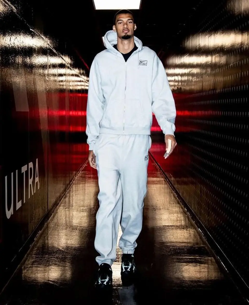 Victor Wembanyama arrives at Frost Bank Center in a light gray Nike sweatsuit ahead of Game 4 against the Oklahoma City Thunder.