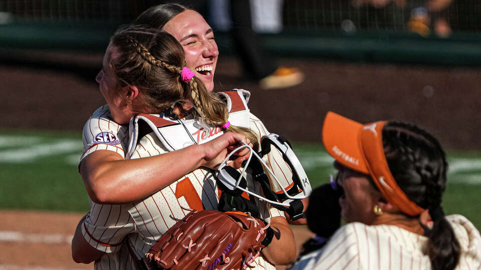 Texas Longhorns pitcher Teagan Kavan (17) and catcher Reese Atwood (14) celebrate after winning the NCAA Softball Championship Super Regional final against Arizona State at Red & Charline McCombs Field on Sunday, May 24, 2026 in Austin.
