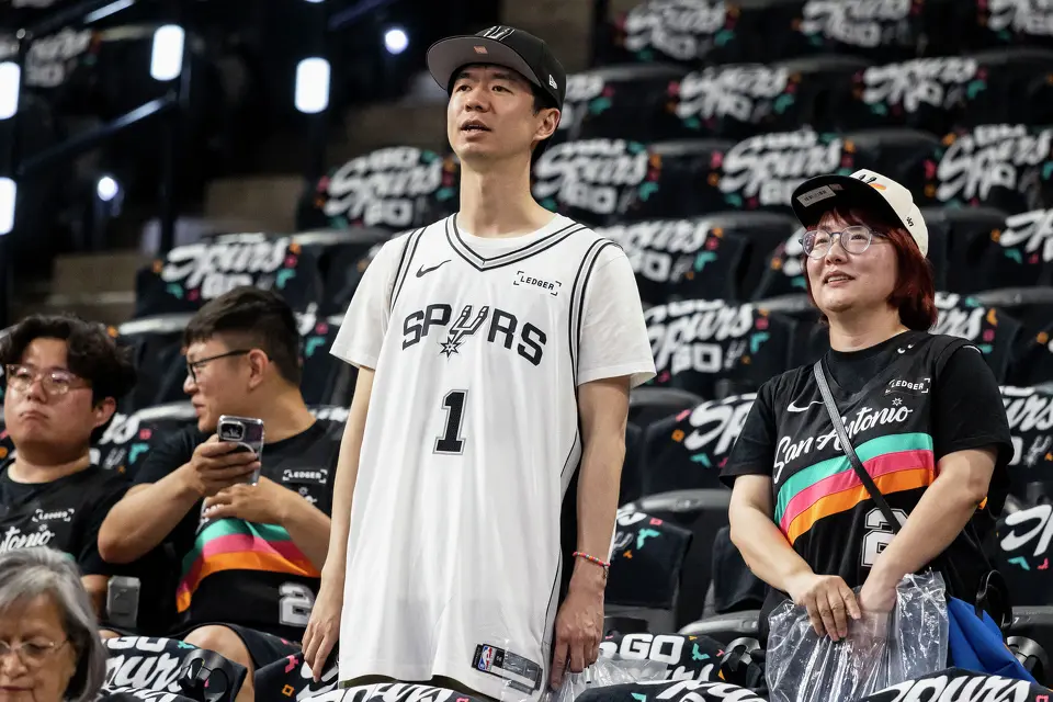 Shiyao Wu, left, and Angie Jin wait for the start of Game 4 of the Western Conference Finals at Frost Bank Center in San Antonio on Sunday, May 24, 2026. Wu and Jin traveled from San Francisco for the game.