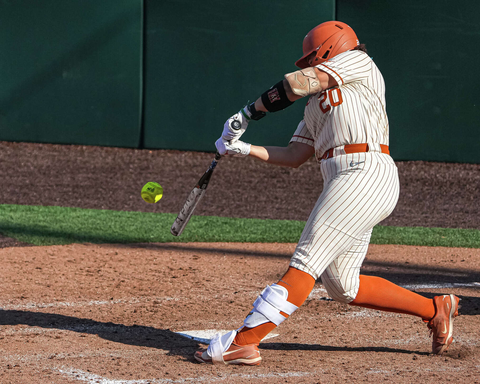 Texas Longhorns infielder Katie Stewart (20) hits a pitch during the NCAA Softball Championship Super Regional final against Arizona State at Red & Charline McCombs Field on Sunday, May 24, 2026 in Austin.