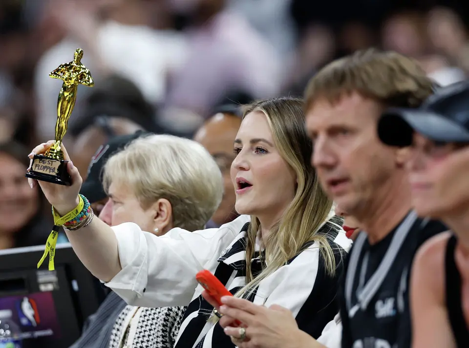 A spurs fan flashes a “best flopper” trophy at a Thunders player during the first quarter of Game 4 of the Western Conference Finals at Frost Bank Center in San Antonio, Sunday, May 24, 2026.