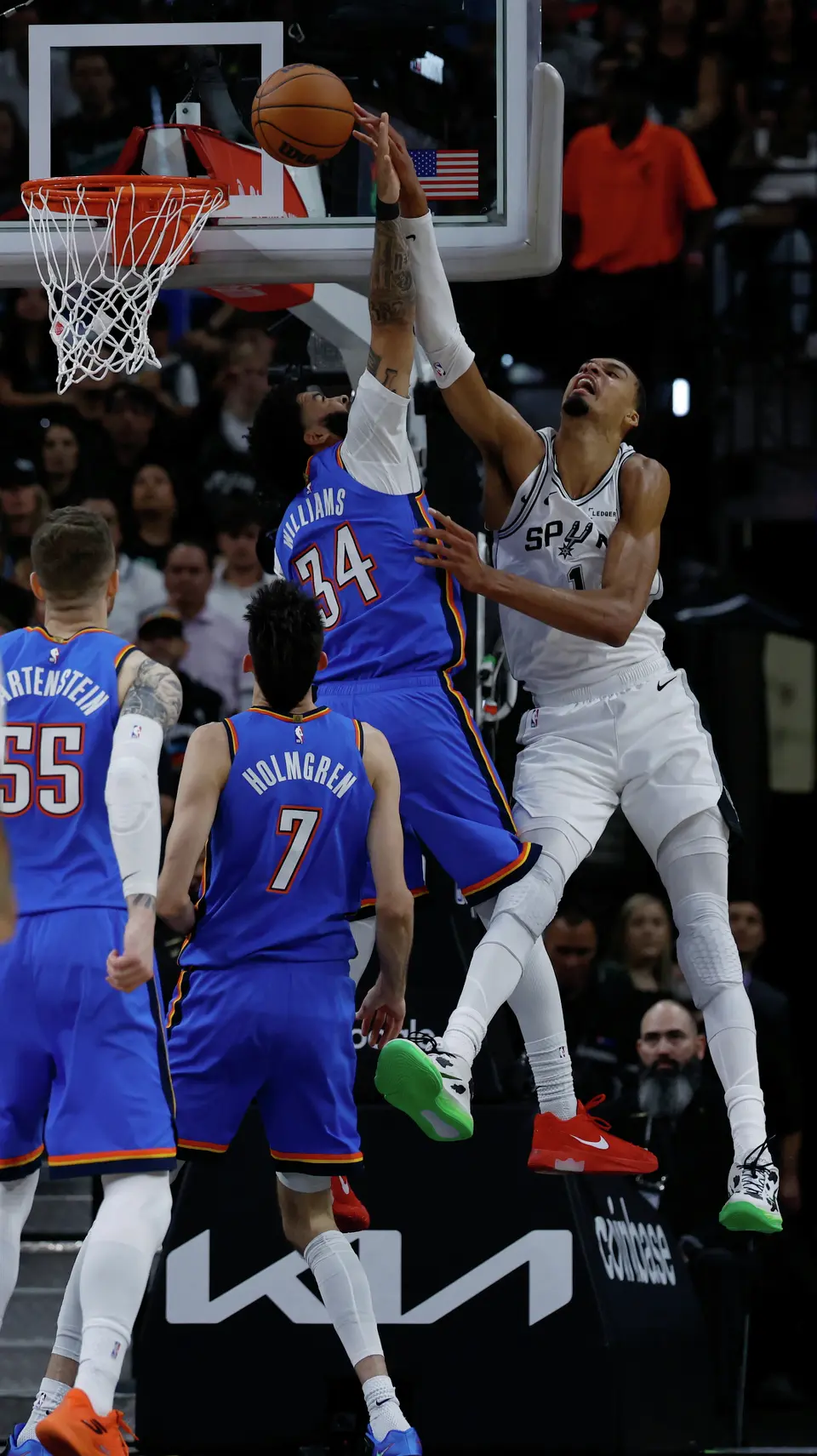 San Antonio Spurs forward Victor Wembanyama (1) blocks a shot by Oklahoma City Thunder guard Kenrich Williams (34) during the first quarter of Game 4 of the Western Conference Finals at Frost Bank Center in San Antonio, Sunday, May 24, 2026.