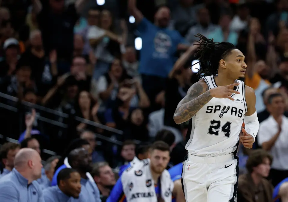 San Antonio Spurs guard Devin Vassell (24) flashes the three sign after dropping a three point bucket during the first quarter of Game 4 of the Western Conference Finals at Frost Bank Center in San Antonio, Sunday, May 24, 2026.