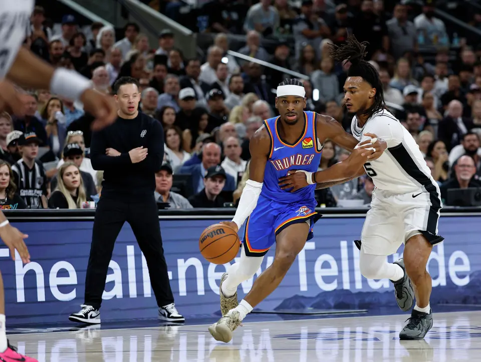 Oklahoma City Thunder guard Shai Gilgeous-Alexander (2) drives to the basket past San Antonio Spurs guard Stephon Castle (5) during the first quarter of Game 4 of the Western Conference Finals at Frost Bank Center in San Antonio, Sunday, May 24, 2026.