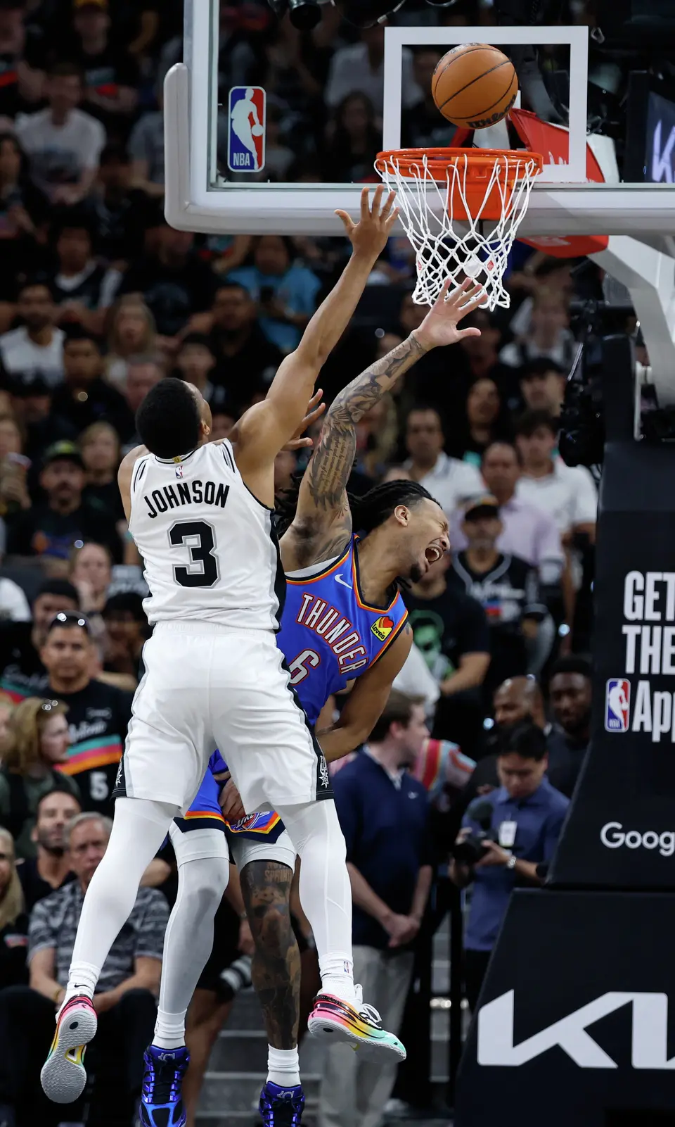 San Antonio Spurs forward Keldon Johnson (3) gets the layup over Oklahoma City Thunder forward Jaylin Williams (6) during the first quarter of Game 4 of the Western Conference Finals at Frost Bank Center in San Antonio, Sunday, May 24, 2026.