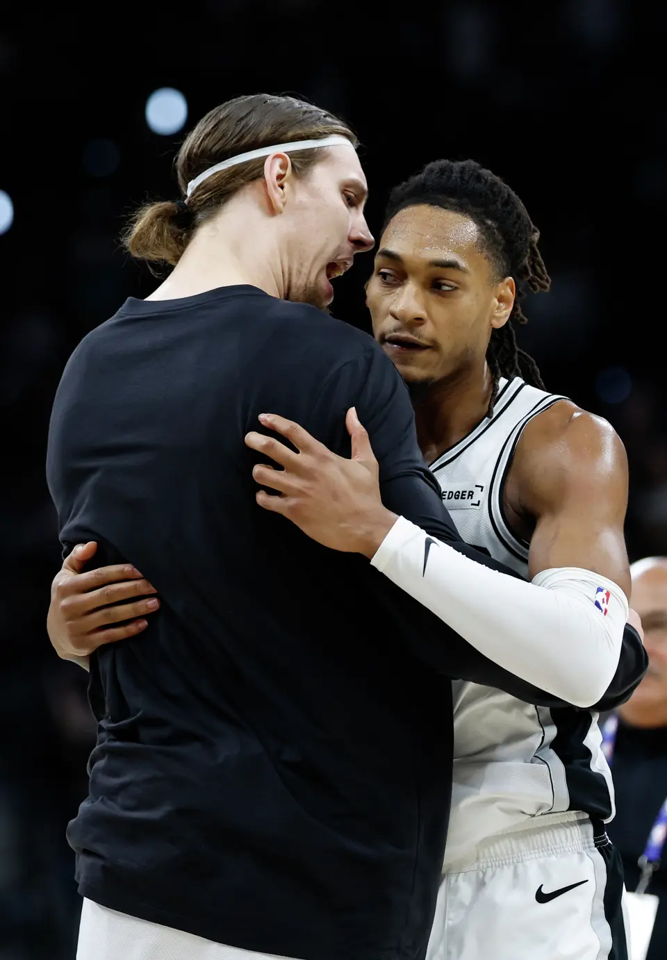 San Antonio Spurs forward Kelly Olynyk (8) celebrates with San Antonio Spurs guard Devin Vassell (24) at the end second quarter with the Spurs headed to the locker room with a sizable lead over the Oklahoma Thunder in Game 4 of the Western Conference Finals at Frost Bank Center in San Antonio, Sunday, May 24, 2026.