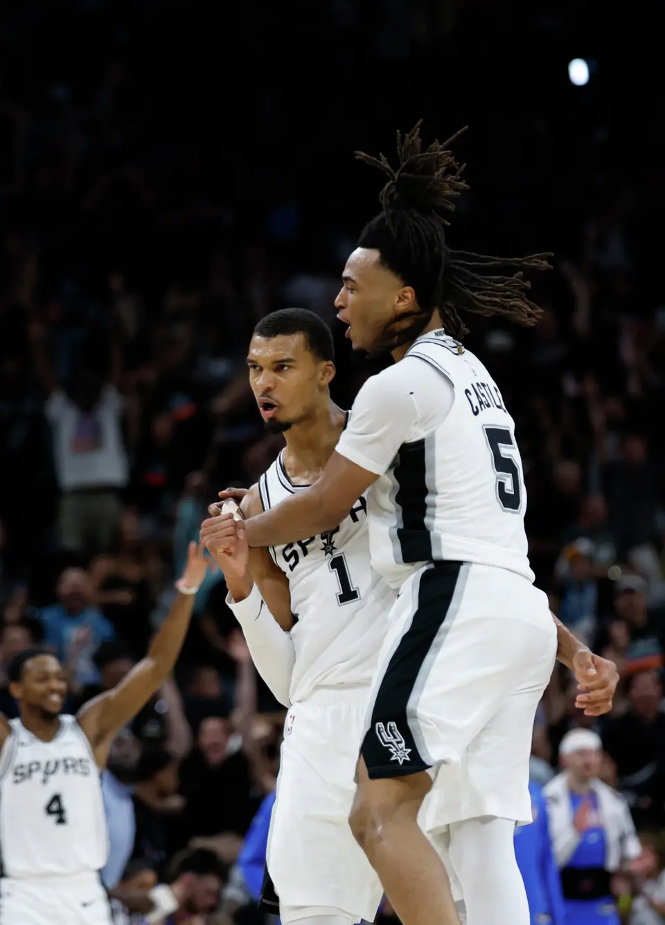 San Antonio Spurs forward Victor Wembanyama (1) and San Antonio Spurs guard Stephon Castle (5) celebrate Wembanyama’s three point shot at the buzzer to end the second quarter of Game 4 of the Western Conference Finals at Frost Bank Center in San Antonio, Sunday, May 24, 2026.