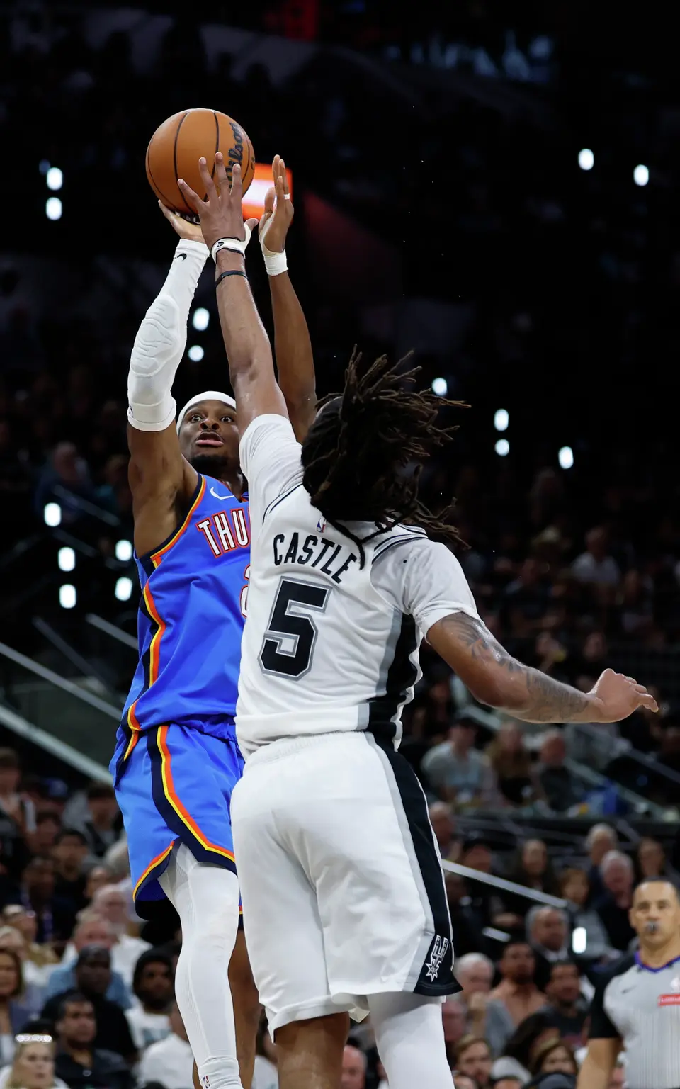 Oklahoma City Thunder guard Shai Gilgeous-Alexander (2) tries to get a shot off over San Antonio Spurs guard Stephon Castle (5) during the second quarter of Game 4 of the Western Conference Finals at Frost Bank Center in San Antonio, Sunday, May 24, 2026.