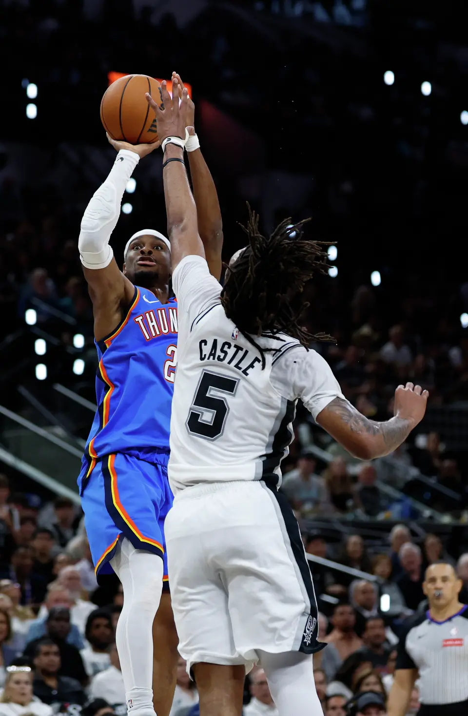 Oklahoma City Thunder guard Shai Gilgeous-Alexander (2) tries to get a shot off over San Antonio Spurs guard Stephon Castle (5) during the second quarter of Game 4 of the Western Conference Finals at Frost Bank Center in San Antonio, Sunday, May 24, 2026.