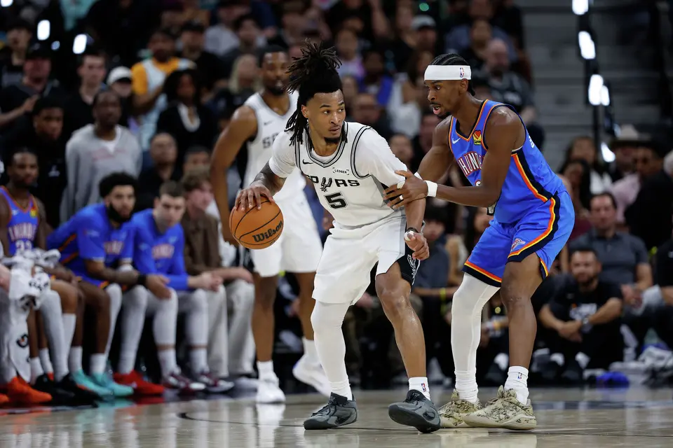 San Antonio Spurs guard Stephon Castle (5) sets a play in motion as Oklahoma City Thunder guard Shai Gilgeous-Alexander (2) guards him during the second quarter of Game 4 of the Western Conference Finals at Frost Bank Center in San Antonio, Sunday, May 24, 2026.