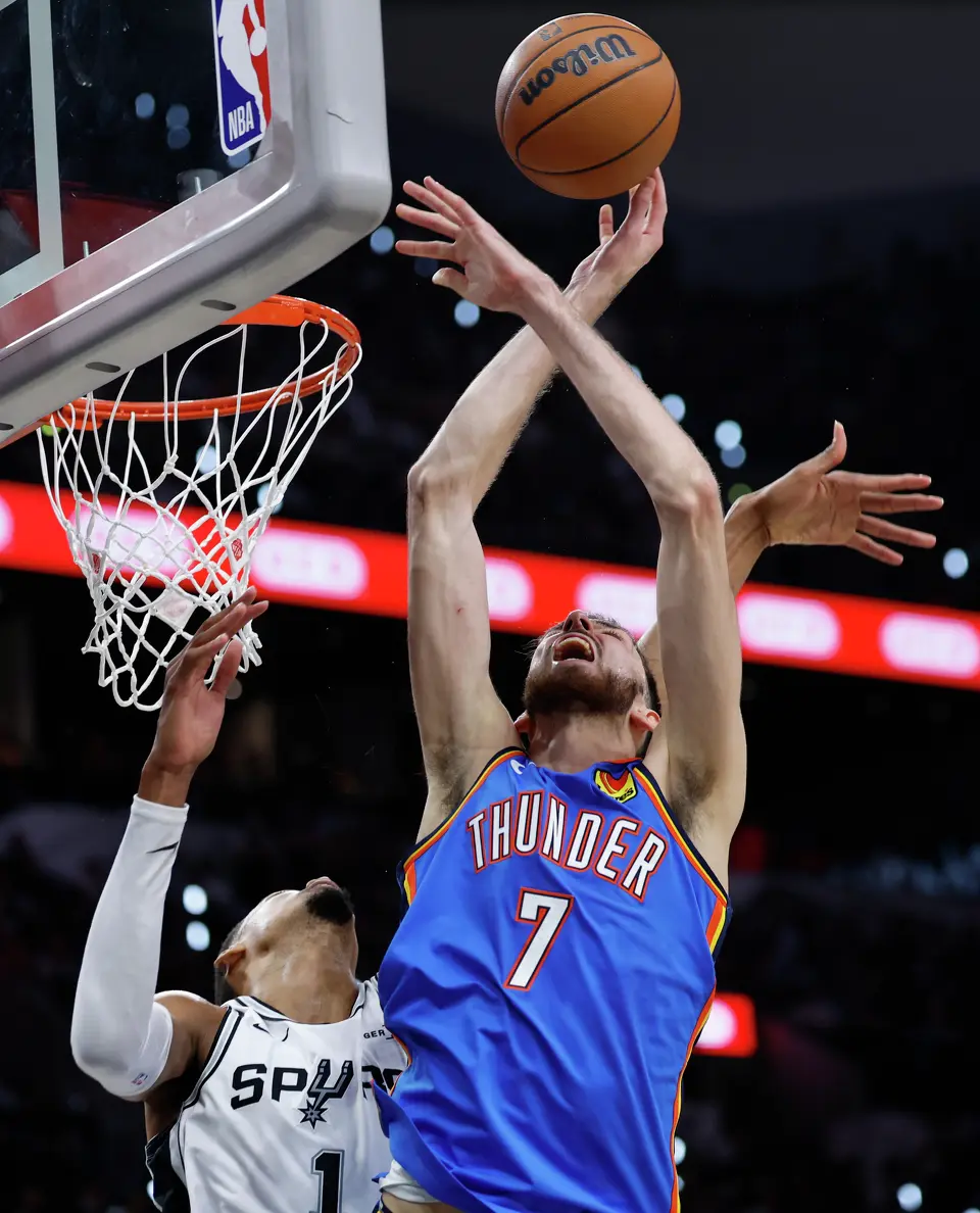Oklahoma City Thunder center Chet Holmgren (7) has the ball knocked away by San Antonio Spurs forward Victor Wembanyama (1) during the second quarter of Game 4 of the Western Conference Finals at Frost Bank Center in San Antonio, Sunday, May 24, 2026.