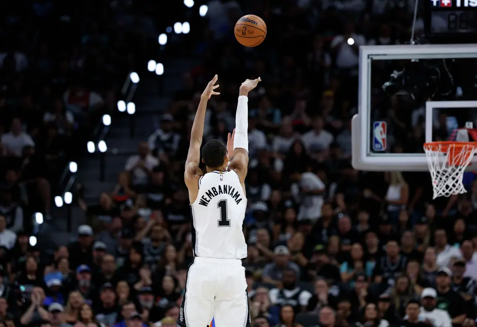 San Antonio Spurs forward Victor Wembanyama (1) makes a three point miracle shot from well outside the three point line right at the buzzer ending the second quarter of Game 4 of the Western Conference Finals at Frost Bank Center in San Antonio, Sunday, May 24, 2026.
