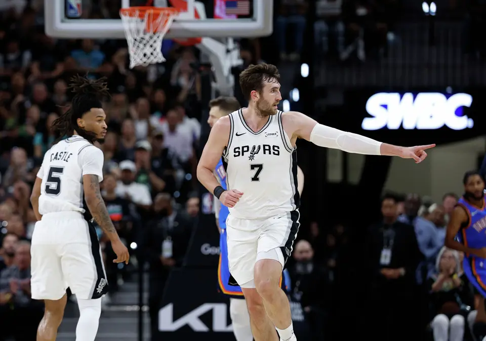 San Antonio Spurs center Luke Kornet (7) points to the bench after scoring during the second quarter of Game 4 of the Western Conference Finals at Frost Bank Center in San Antonio, Sunday, May 24, 2026.