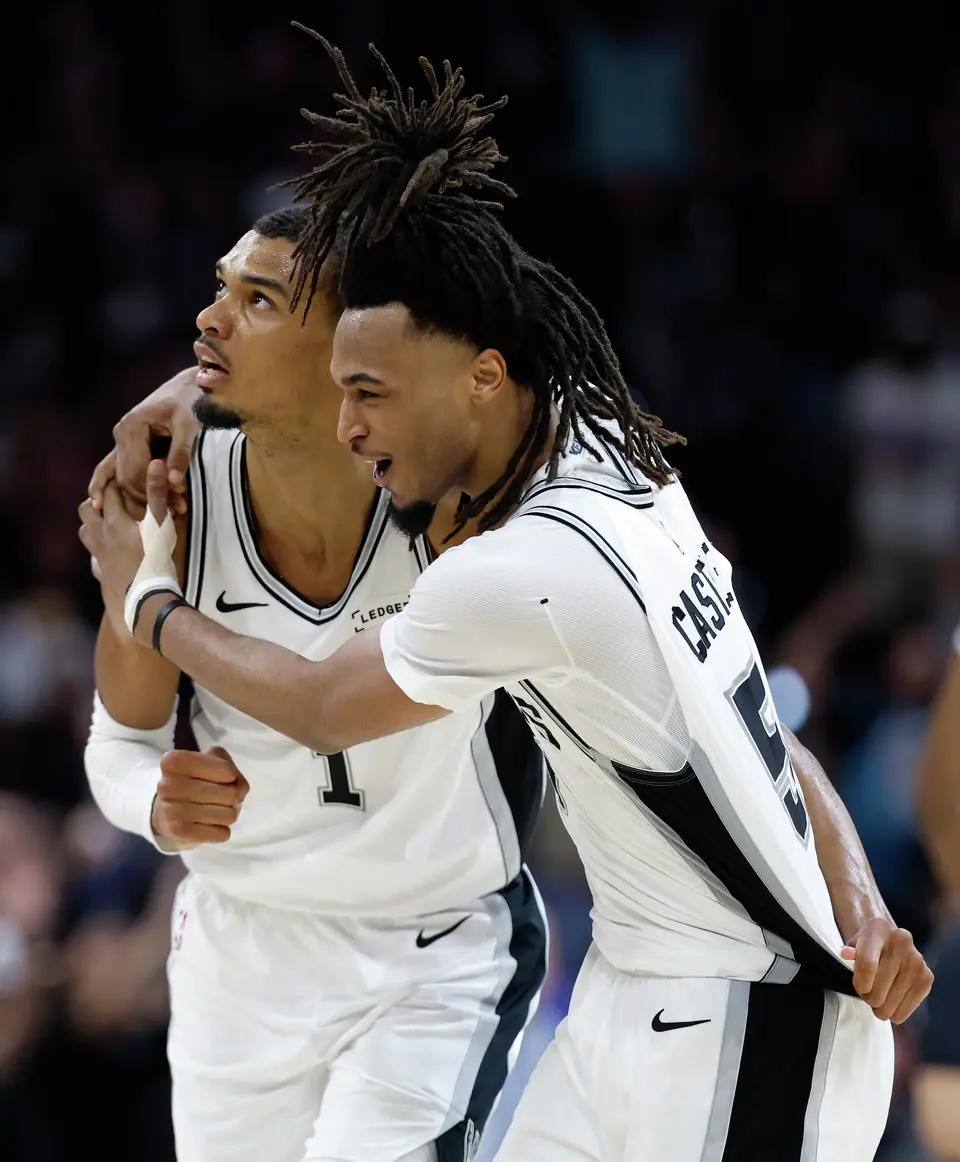 San Antonio Spurs forward Victor Wembanyama (1) and San Antonio Spurs guard Stephon Castle (5) celebrate Wembanyama’s three point shot at the buzzer to end the second quarter of Game 4 of the Western Conference Finals at Frost Bank Center in San Antonio, Sunday, May 24, 2026.
