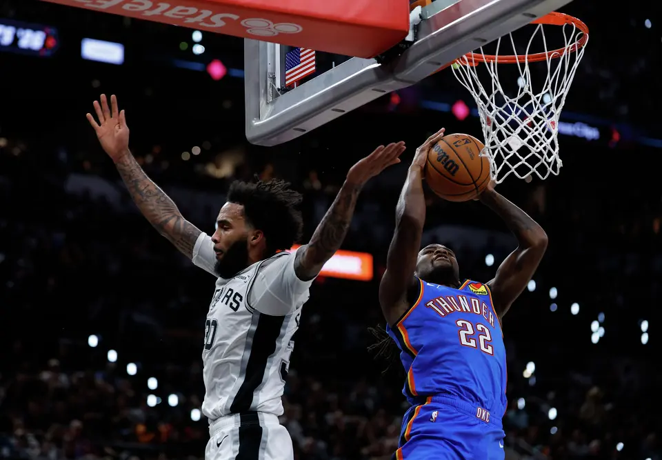 San Antonio Spurs forward Julian Champagnie (30 )throws off Oklahoma City Thunder guard Cason Wallace (22) who misses an easy basket during the second quarter of Game 4 of the Western Conference Finals at Frost Bank Center in San Antonio, Sunday, May 24, 2026.