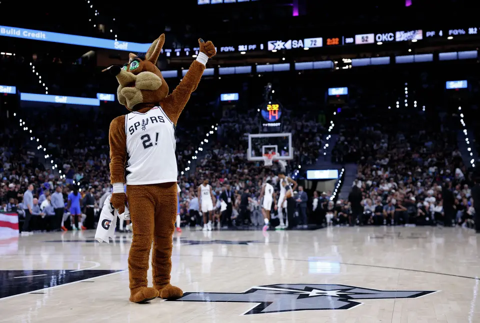 The San Antonio Spurs Coyote riles up the fans during the third quarter of Game 4 of the Western Conference Finals at Frost Bank Center in San Antonio, Sunday, May 24, 2026.