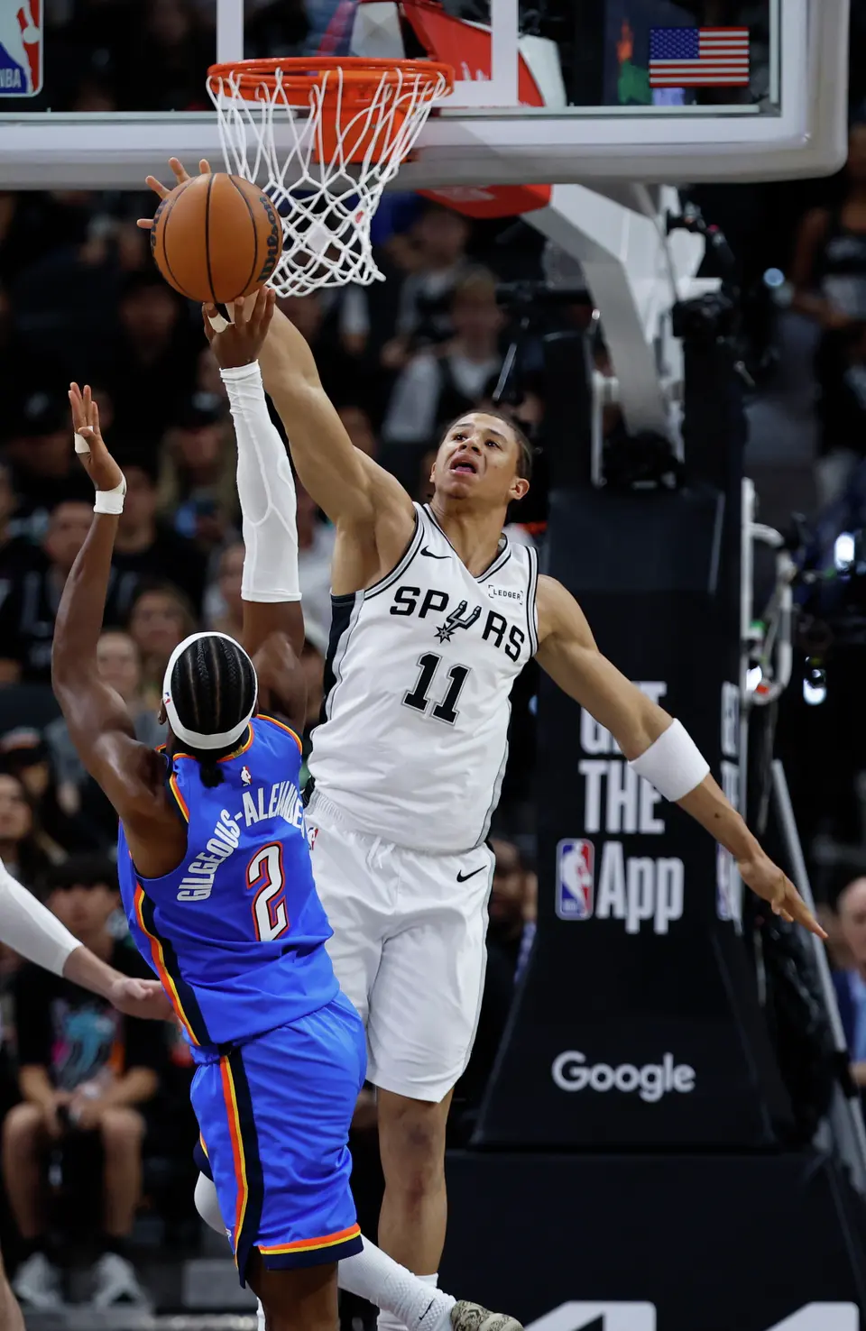 San Antonio Spurs forward Carter Bryant (11) blocks a shot by Oklahoma City Thunder guard Shai Gilgeous-Alexander (2) during the third quarter of Game 4 of the Western Conference Finals at Frost Bank Center in San Antonio, Sunday, May 24, 2026.