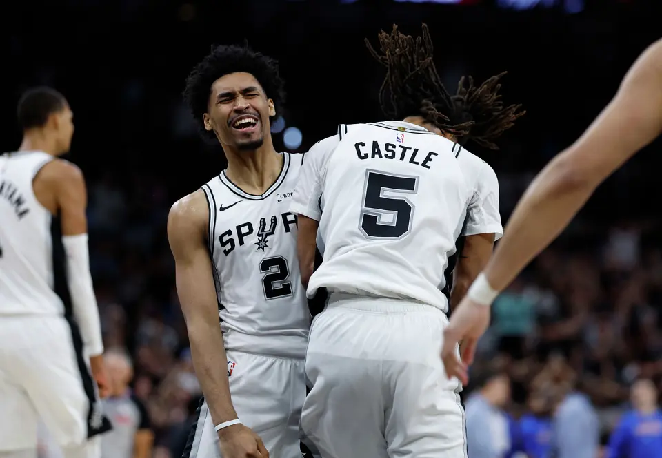 San Antonio Spurs guard Dylan Harper (2) and San Antonio Spurs guard Stephon Castle (5) celebrate as the Spurs begin to pull away from the Thunder during the third quarter of Game 4 of the Western Conference Finals at Frost Bank Center in San Antonio, Sunday, May 24, 2026.